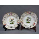 Pair of Meissen bird pattern porcelain plates, with reticulated border and gilt edge rim, blue