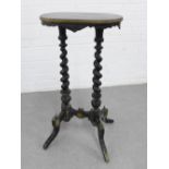 19th century ebonised and parcel gilt plant stand on twin barley twist supports with a stretcher and