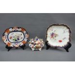 Royal Worcester porcelain dish painted with flowers to a white ground within a blue and gilt border,