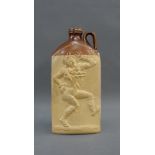 Stoneware bottle with a Jester figure in relief, with a loop handle to top, 24cm high
