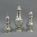 Three silver sugar castors, tallest 17cm high (3)