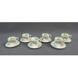 Set of six Royal Doulton Glamis Thistle pattern cups and saucers, each signed P. Curnock, (12)