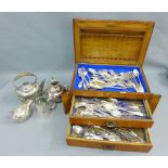 An oak cutlery canteen containing silver and Epns flatwares with mixed makers and hallmarks,