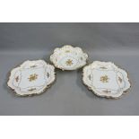 German white glazed table wares to include a bowl and two serving dishes, all with gilt floral