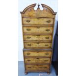 Walnut chest on chest, with a broken swan neck pediment and central urn over four drawers to the top