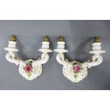 A pair of German pottery twin branch candelabra, with encrusted rose pattern (2)