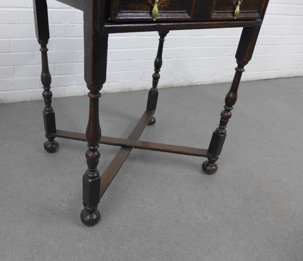 Oak side table with single frieze drawer with two brass drop handles, cross stretcher and bun - Image 3 of 3