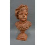 Terracotta head and shoulders bust of a young boy, on socle base, 36cm high