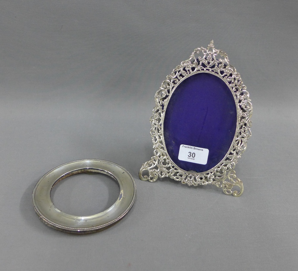 George VI silver photograph frame, London 1948, 19cm high, together with an unmarked silver circular