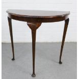 Mahogany demi lune table on shell carved cabriole legs with pad feet, 72 x 77cm