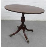 Modern mahogany pedestal table with an oval top, 56 x 67cm