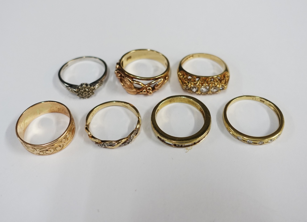 A collection of six 9ct gold rings and another unmarked yellow metal ring (7)