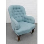 Buttonback armchair, smartly upholstered in pale blue linen fabric, on cabriole legs with brass caps