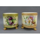 Pair of floral patterned cache pots, on three gilt feet, 11cm diameter (2)