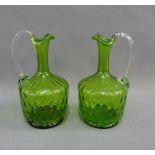 Pair of green dimpled glass decanter / ewers, 20cm high (2)