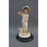 Capodimonte Italian, figure modeled by Vittorio Tesaro, on a circular wooden base, 24cm high