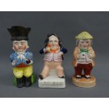 Staffordshire figure, Toby jug and cruet figure with a lustrous glaze, tallest 15cm (3)