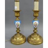 A pair of French candlesticks, converted to table lamps with Serves style porcelain knop stems, 36cm