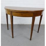 Mahogany and inlaid foldover demi lune table, with a central frieze drawer and tapering legs, 70 x