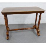 Mahogany table, the rectangular top with canted edge, on ring turned two supports and stretcher,