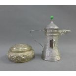 Persian white metal coffee pot, with domed lid, angular handle and chased finely with flowers and
