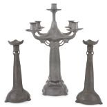 Kayserzinn (German, active 1862-1925)A Pewter Five-light Candleabra and Pair of Candlesticks,