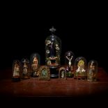 A collection of German blown glass and wax saints, Most 19th/early 20th century