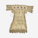 A Southern Plains beaded hide dress with tinklers, 20th century