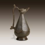 An Iranian bronze lamp in the shape of a ewer, 12th century