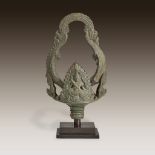 A Khmer bronze ritual bell handle, Angkor period, Bayon style, late 12th/13th century
