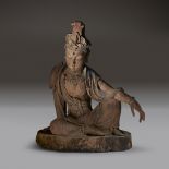 A Chinese carved and painted wood figure of Guanyin, Ming dynasty or earlier