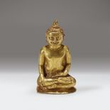 A rare miniature Southeast Asian gold repousse figure of Buddha Shakyamuni, Circa 12th-14th century