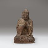 A small Chinese gilt lacquered wood figure of a seated Buddha, Ming dynasty or earlier