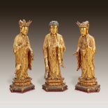 A Chinese lacquered wood Buddhist triad,