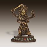 A Nepalese inlaid and embellished parcel-gilt copper alloy figure of Khadga Bhairab (Bhirava), 19th