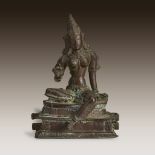 A South Indian bronze figure of a seated Devi, 15th century