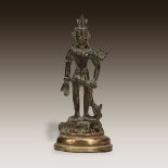 A Tibetan or Kashmiri bronze figure of the Bodhisattva Avalokitesvara, Circa 13th century