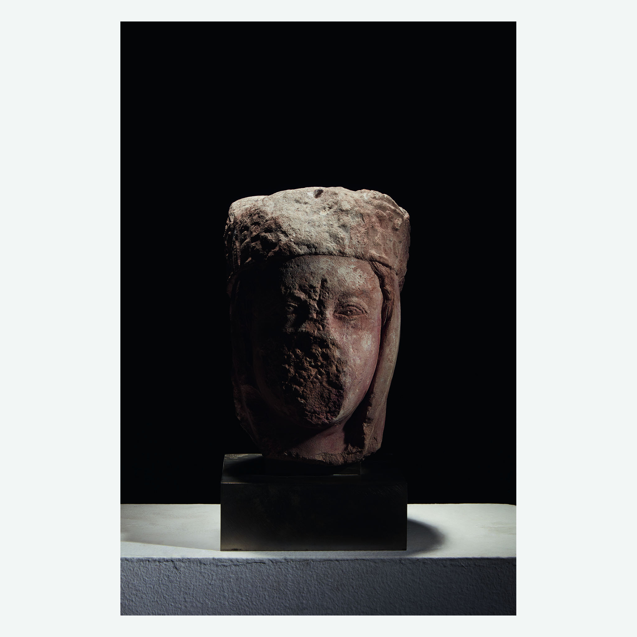 A French Gothic carved limestone portal figure fragment of a head of a queen, Possibly from the Port