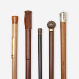 A group of five canes pertaining to smoking, Various dates late 19th/20th century