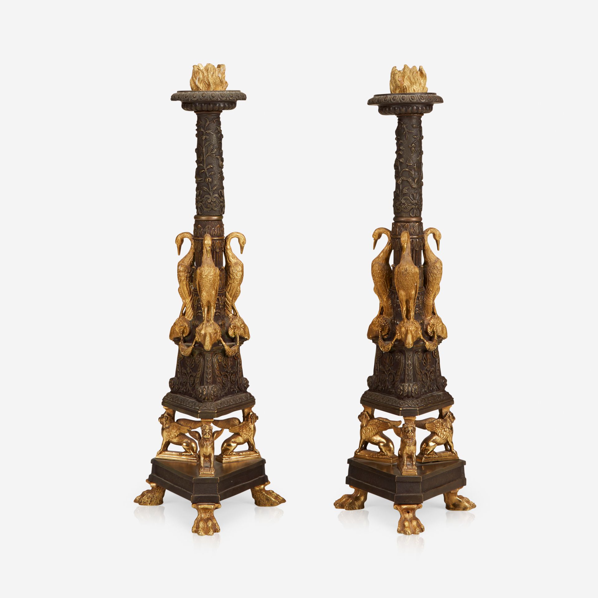 A pair of Empire Revival ormolu and patinated bronze candlesticks, Circa 1880