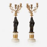 A pair of Empire gilt and patinated bronze and white marble figural four-light candelabra, First qua