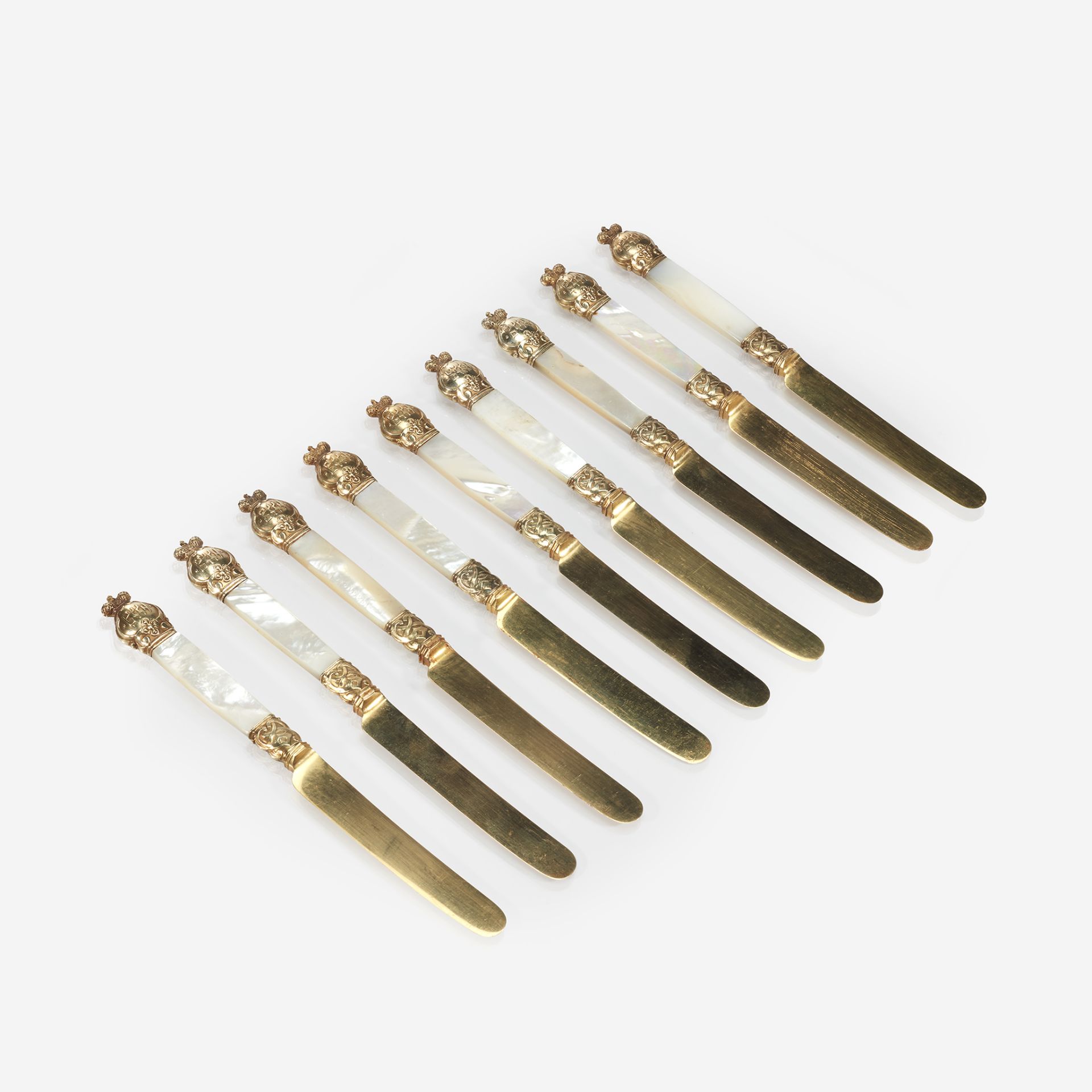 A set of nine Russian silver-gilt, mother-of-pearl, and gilt-steel dessert knives from the service o