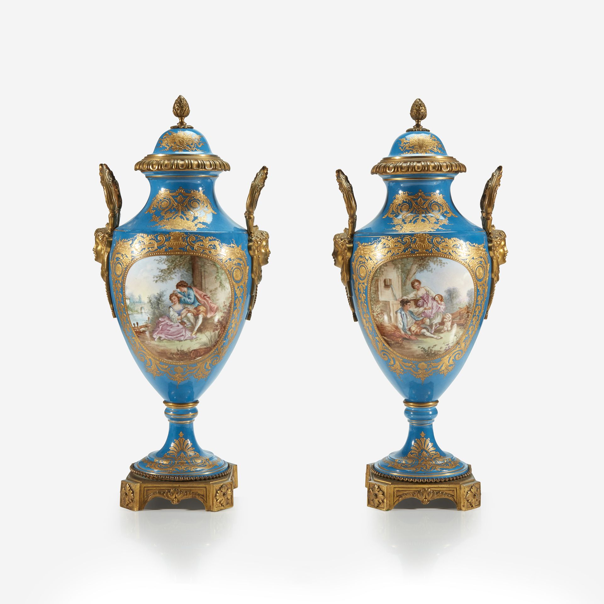 A pair of Sèvres style bleu céleste gilt-metal mounted parcel-gilt and hand-painted covered vases, L