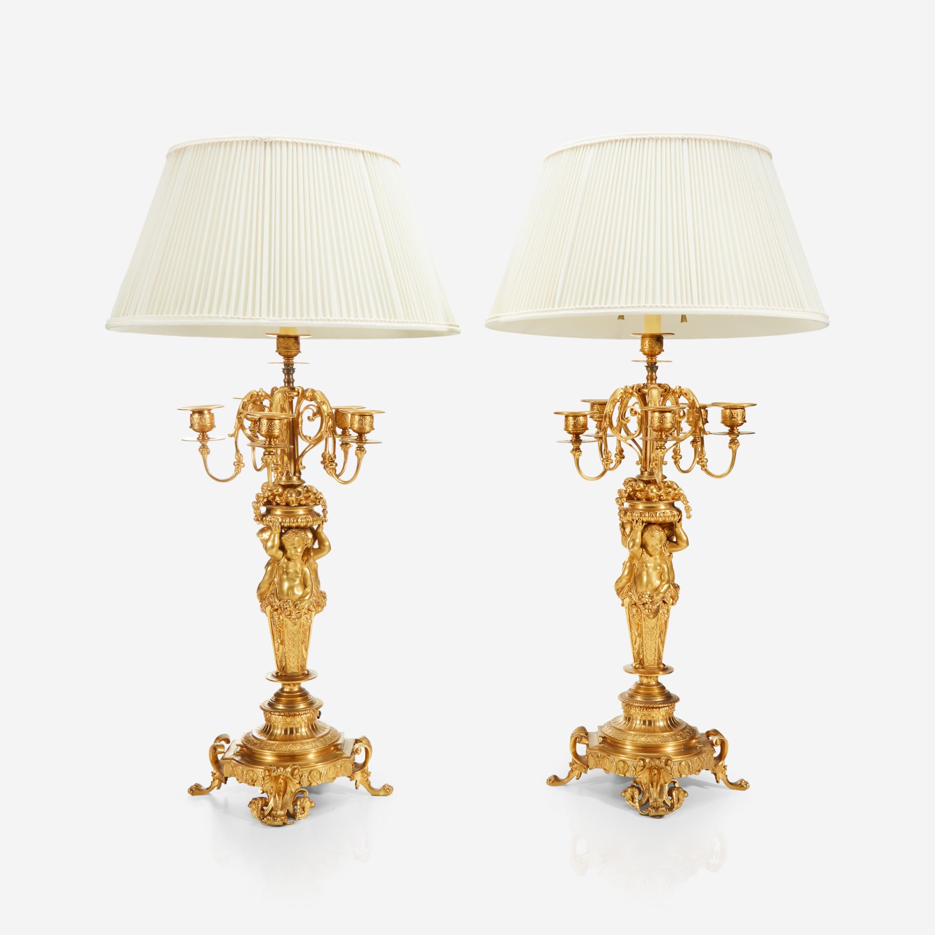 A pair of Napoleon III ormolu five-light figural candelabra, Third quarter 19th century