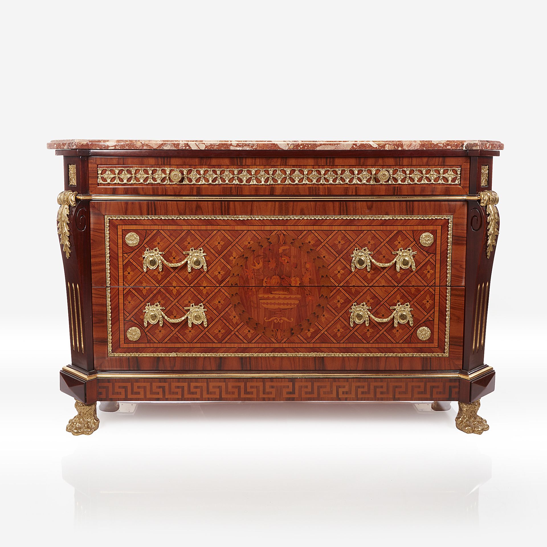 A Louis XVI style gilt-bronze mounted specimen wood marqetry and parquetry kingwood commode with bre