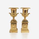 A pair of Charles X ormolu campana urns on pedestals in the manner of Pierre-Philippe Thomire (Frenc