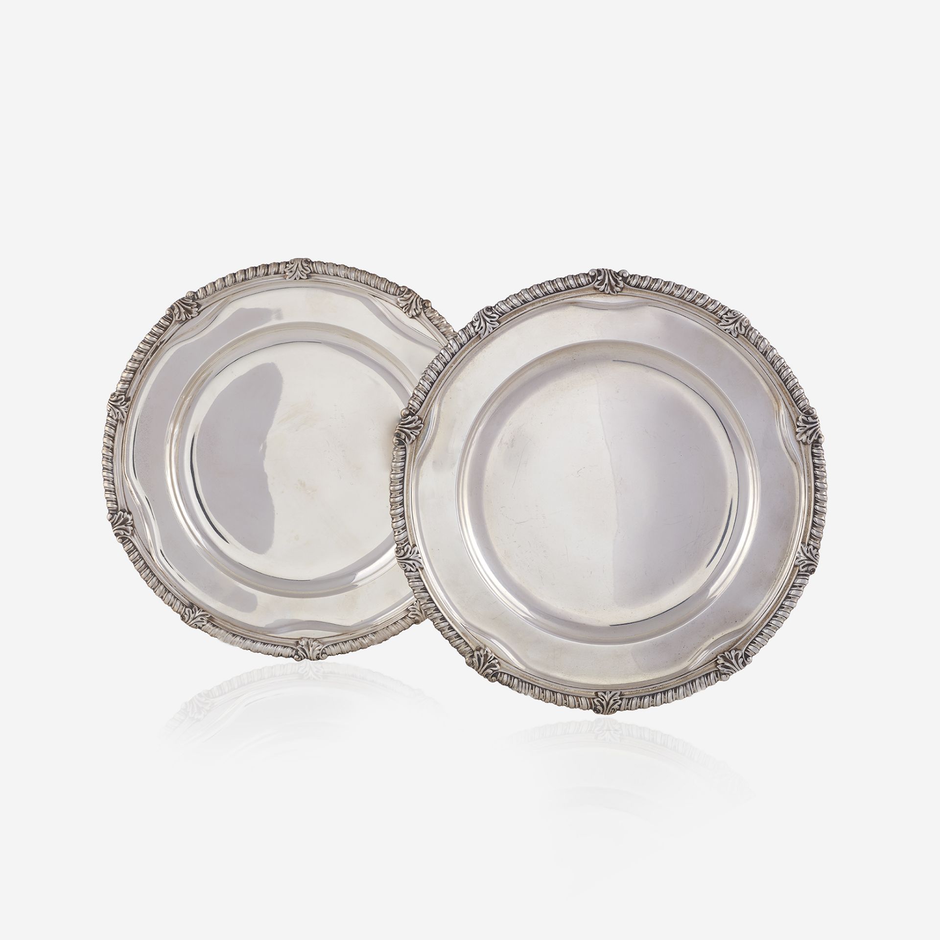 A pair of American sterling silver service plates, Tiffany & Co., New York, 20th century