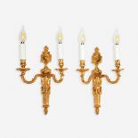 A pair of Louis XVI style gilt-bronze two-light sconces, late 19th/early 20th century