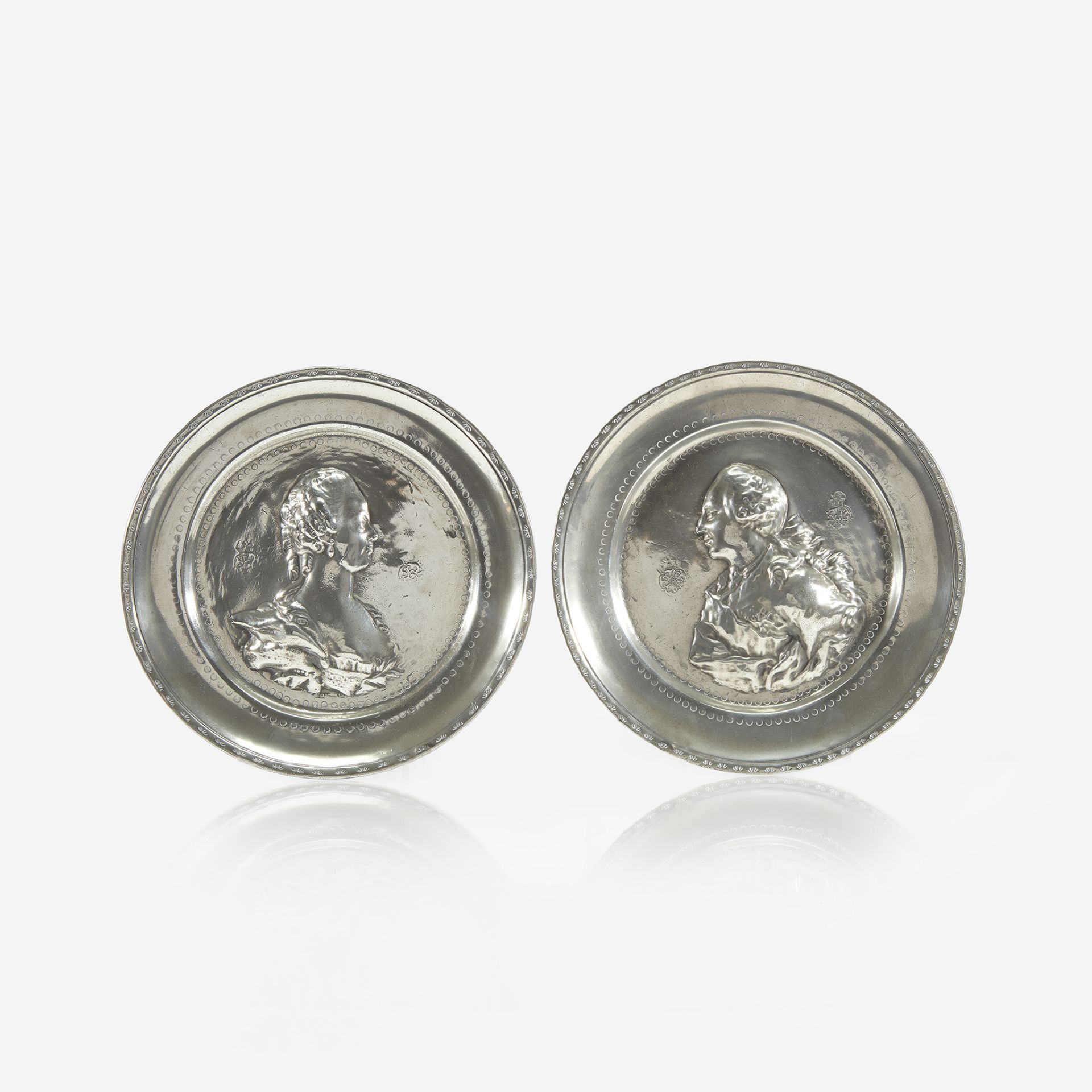 A pair of Continental Royal commemorative pewter plates, 18th century