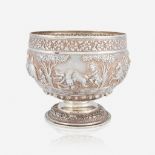 A Southeast Asian repoussé silver bowl decorated with hunt scenes, apparently unmarked